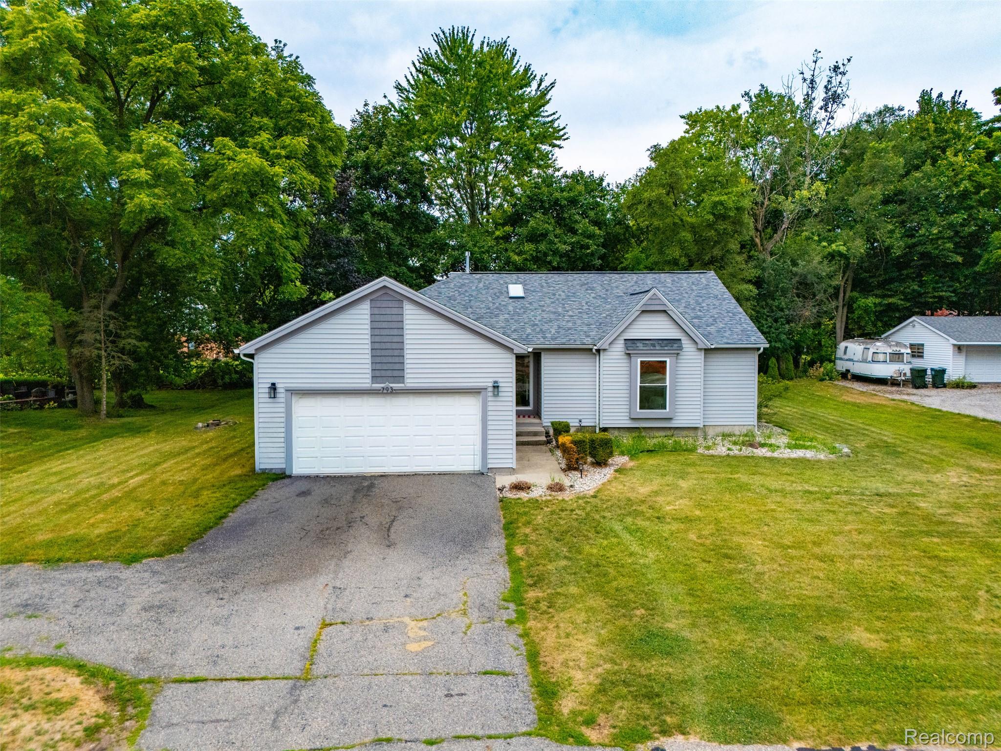 793 North Adams Road Rochester, MI 48309 - Photo 40 of 40 Ranch-style residence featuring light gray siding and a dark gray shingle roof