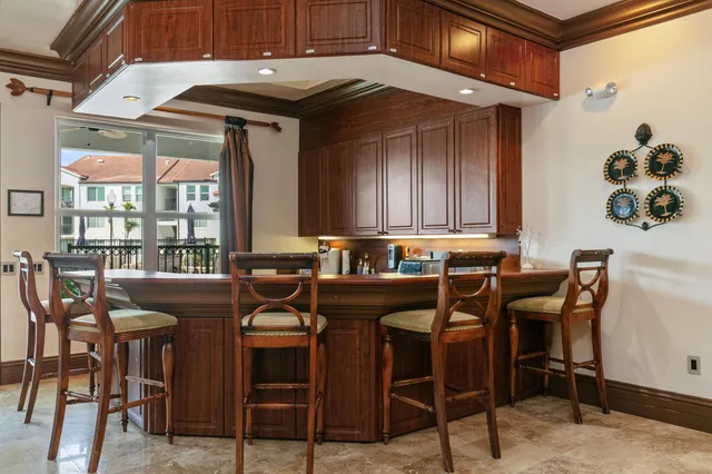 a kitchen with a table and chairs in it