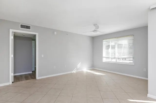a view of an empty room with a window