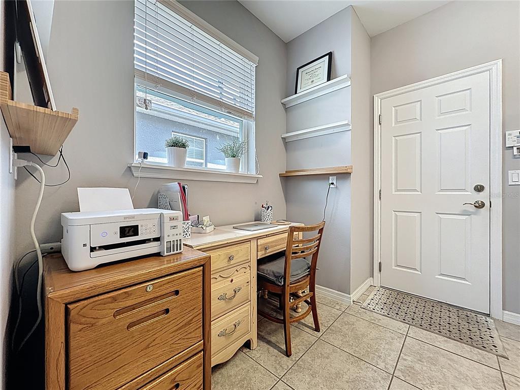277 Silver Maple Road Groveland, FL 34736 - Photo 42 of 81 a kitchen with stainless steel appliances a stove a chimney and a refrigerator