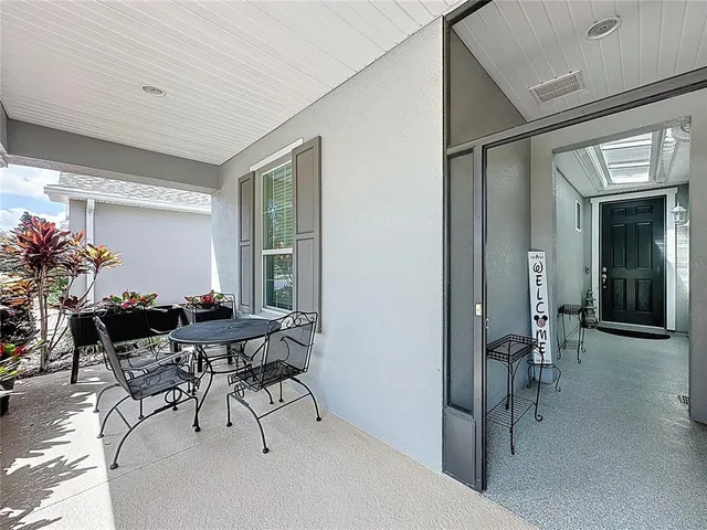 a view of a livingroom with furniture and a potted plant