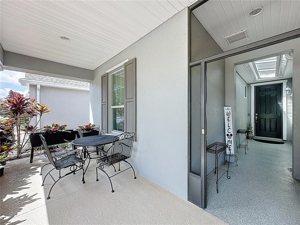 277 Silver Maple Road Groveland, FL 34736 - Photo 5 of 81 a view of a livingroom with furniture and a potted plant