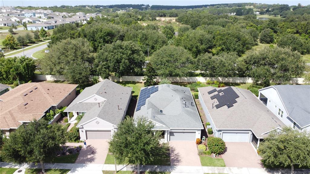 277 Silver Maple Road Groveland, FL 34736 - Photo 56 of 81 an aerial view of a house with outdoor space and lake view