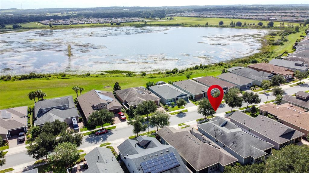 277 Silver Maple Road Groveland, FL 34736 - Photo 58 of 81 an aerial view of a houses with a lake view