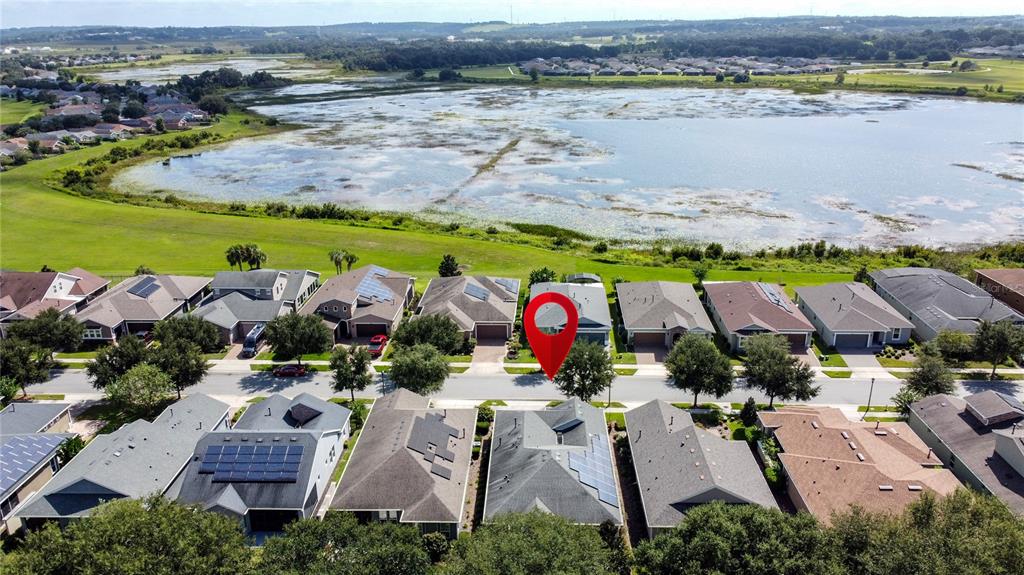 277 Silver Maple Road Groveland, FL 34736 - Photo 59 of 81 an aerial view of residential houses with outdoor space
