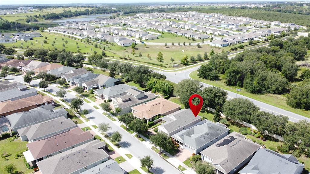 277 Silver Maple Road Groveland, FL 34736 - Photo 63 of 81 an aerial view of a city with lots of residential buildings