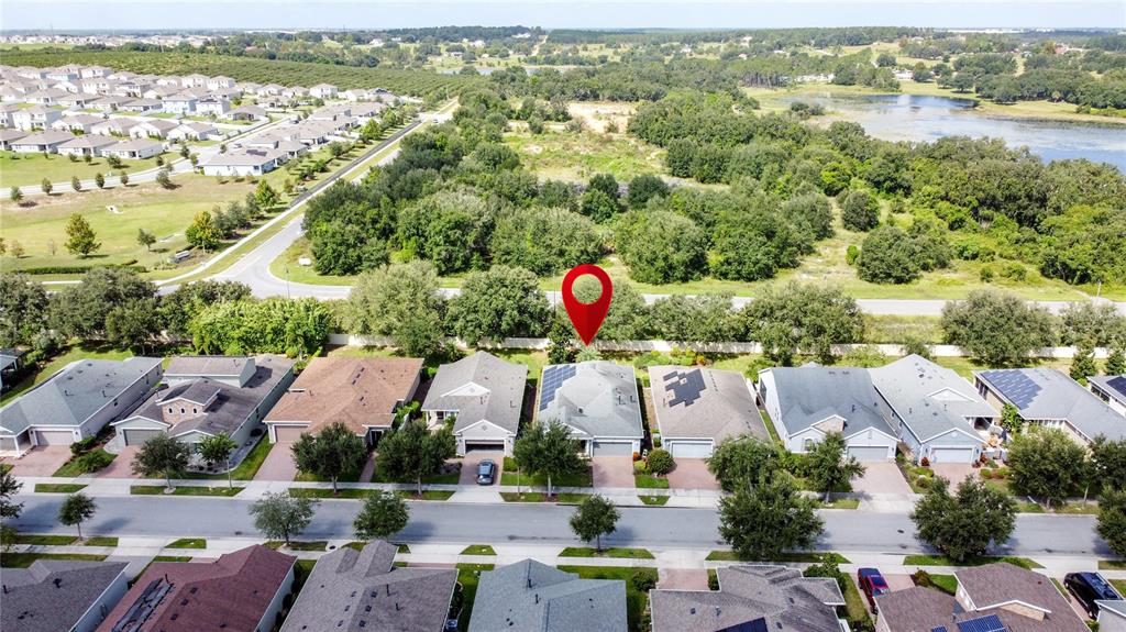277 Silver Maple Road Groveland, FL 34736 - Photo 64 of 81 an aerial view of residential houses with outdoor space and river