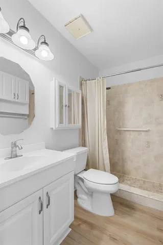 a bedroom with bed and a couch