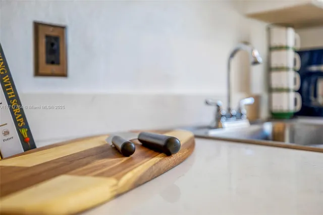 a bedroom with a bed and a night stand