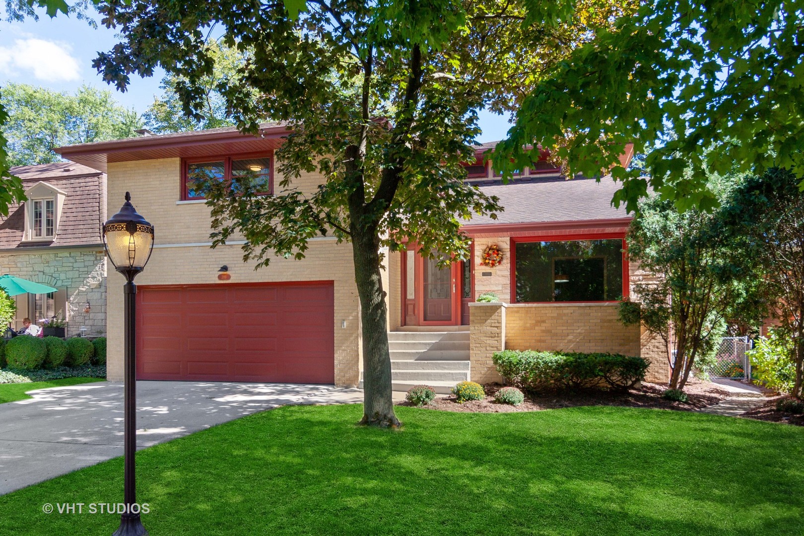 399 Audubon Road Riverside, IL 60546 - Photo 1 of 31 a front view of a house with garden