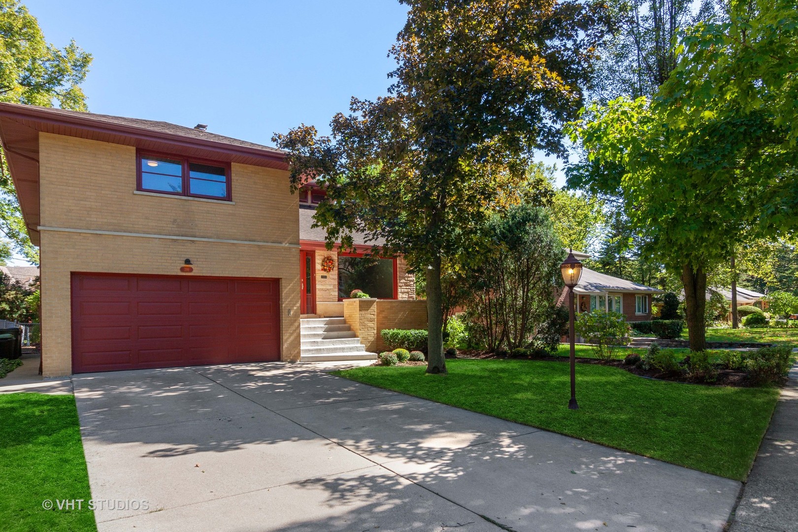 399 Audubon Road Riverside, IL 60546 - Photo 2 of 31 a front view of a house with a yard