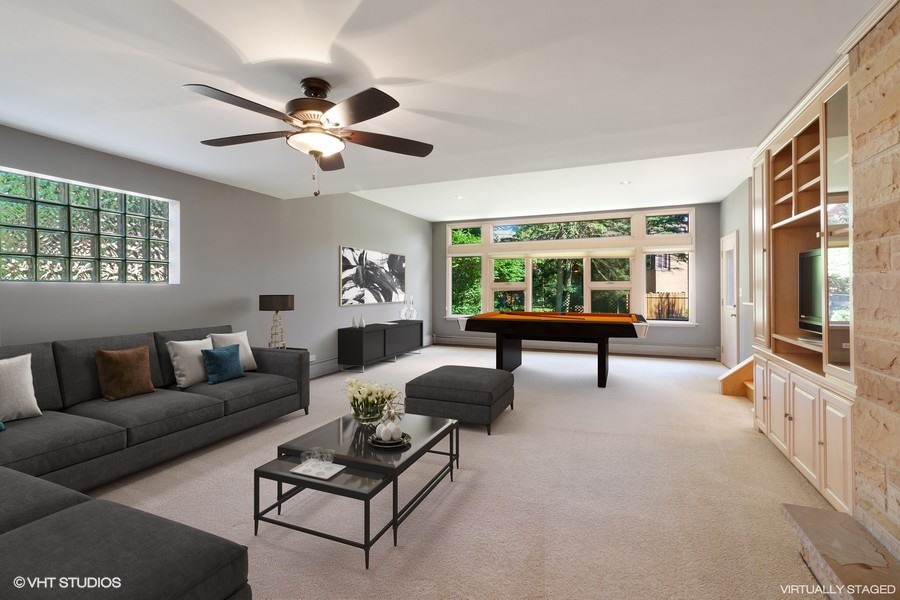 399 Audubon Road Riverside, IL 60546 - Photo 13 of 31 a living room with furniture and a large window with wooden floor