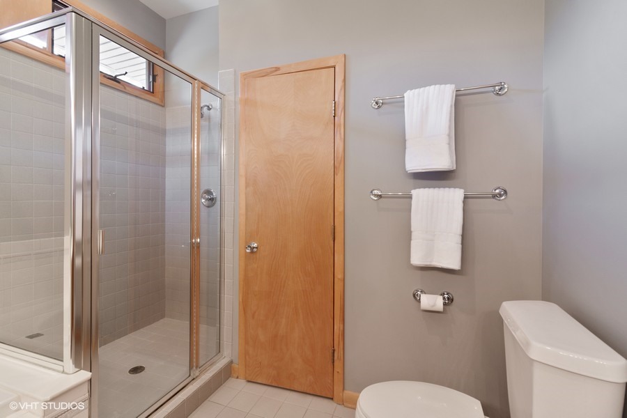 399 Audubon Road Riverside, IL 60546 - Photo 20 of 31 a bathroom with a shower a toilet and a sink