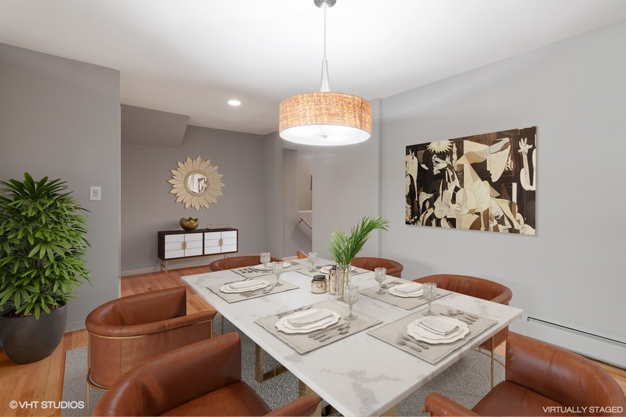 399 Audubon Road Riverside, IL 60546 - Photo 7 of 31 a view of a dining room with furniture and a potted plant