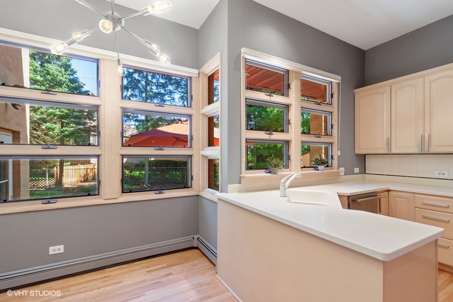 399 Audubon Road Riverside, IL 60546 - Photo 8 of 31 a kitchen with a sink and large window
