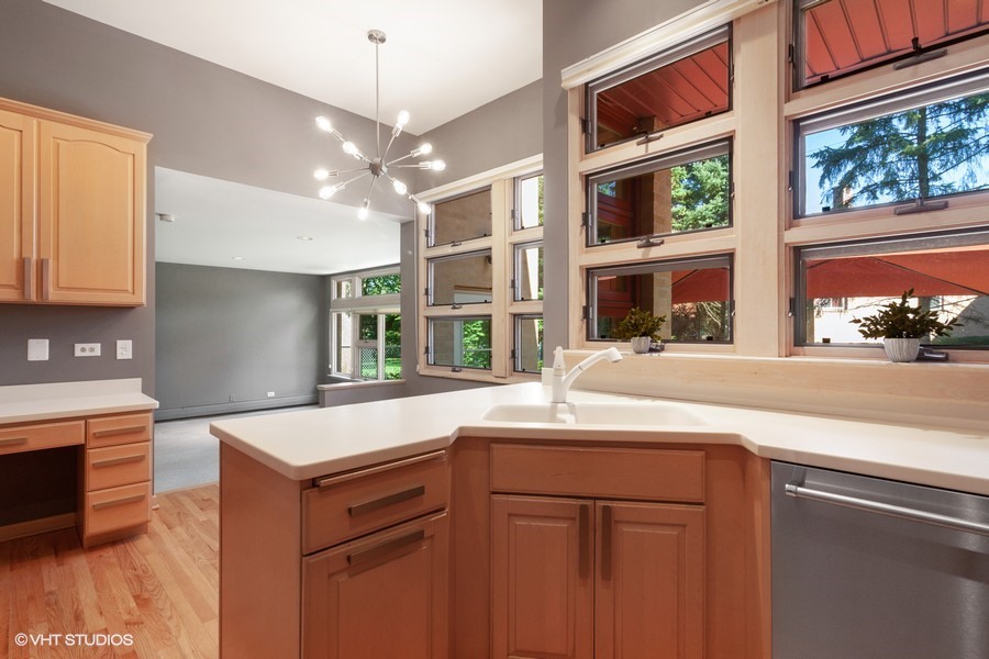 399 Audubon Road Riverside, IL 60546 - Photo 10 of 31 a kitchen with a sink and a stove