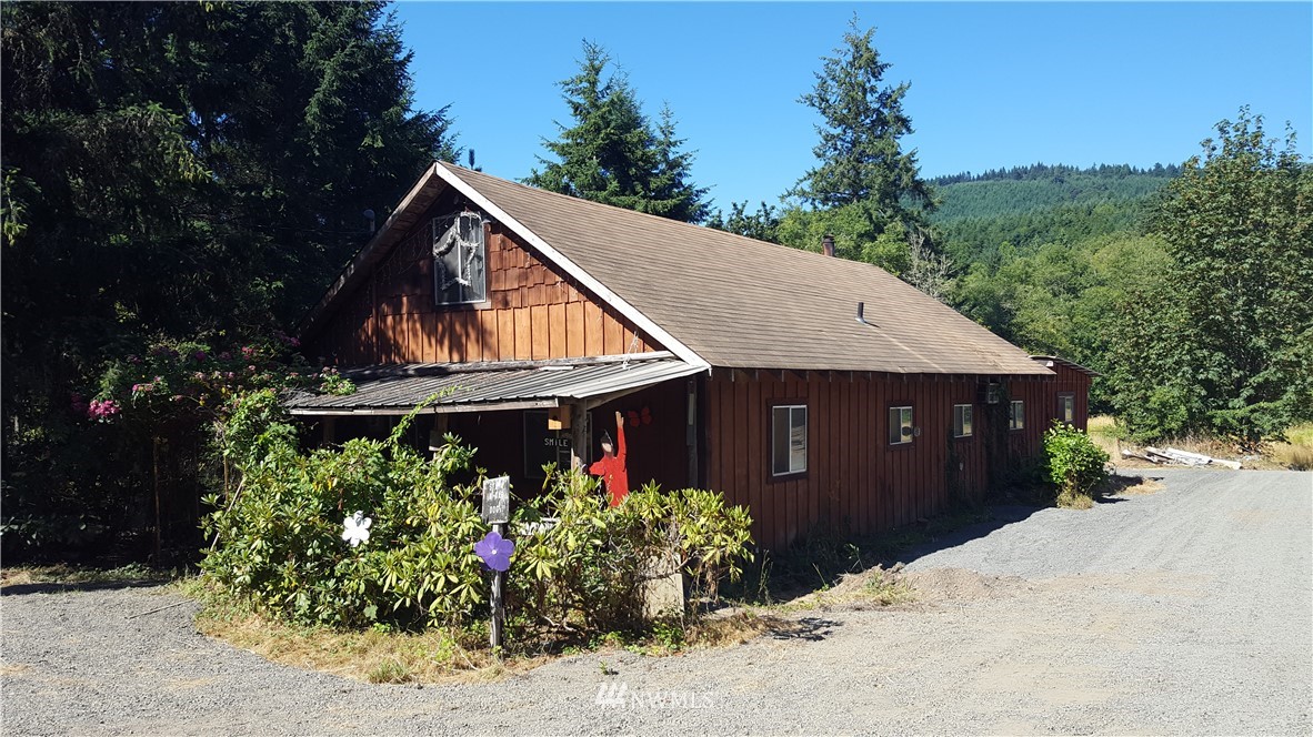 1499 King Road Winlock, WA 98596 - Photo 1 of 16 a view of a house covered with trees