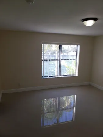 a kitchen with stainless steel appliances granite countertop a refrigerator and a stove