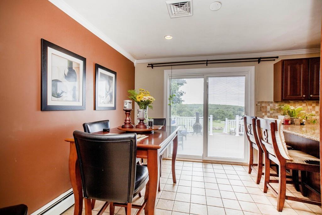 44 Dolan Road Millbury, MA 01527 - Photo 12 of 40 a dining room with furniture a rug and a large window