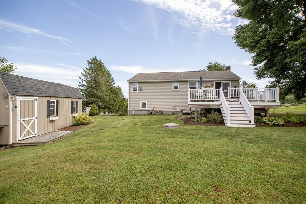 44 Dolan Road Millbury, MA 01527 - Photo 17 of 40 a front view of a house with a garden