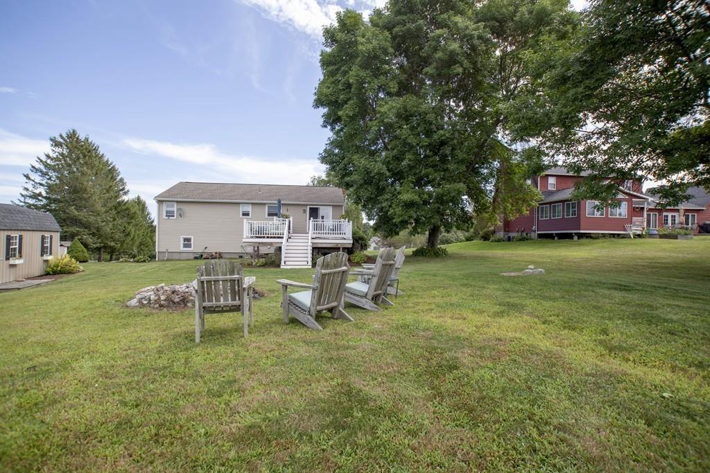 44 Dolan Road Millbury, MA 01527 - Photo 18 of 40 a view of a house with a yard porch and sitting area