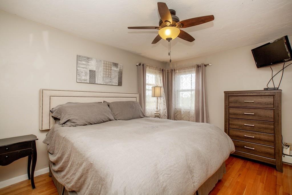 44 Dolan Road Millbury, MA 01527 - Photo 20 of 40 a bedroom with a bed and a flat screen tv