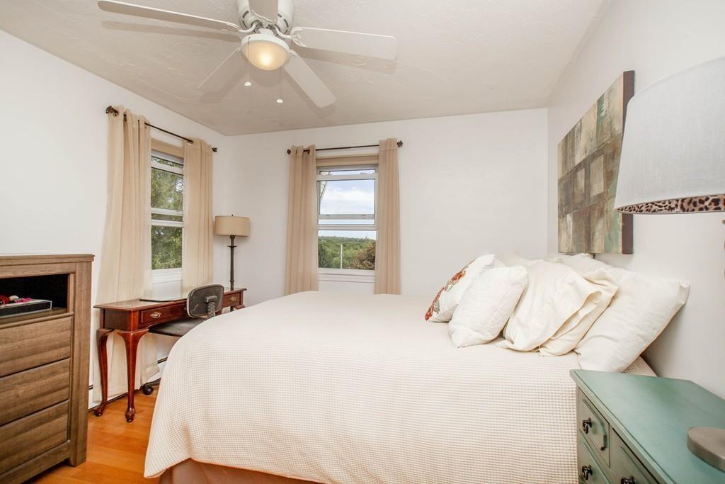 44 Dolan Road Millbury, MA 01527 - Photo 21 of 40 a bedroom with a bed and a chandelier