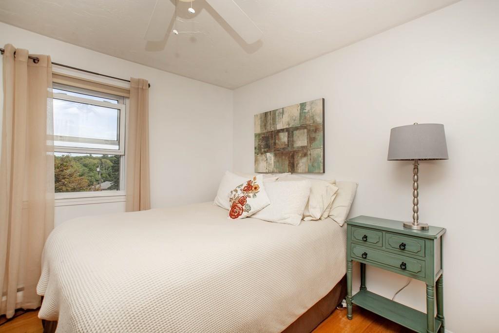 44 Dolan Road Millbury, MA 01527 - Photo 22 of 40 a bedroom with a bed and a night stand