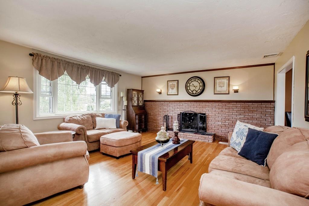 44 Dolan Road Millbury, MA 01527 - Photo 3 of 40 a living room with furniture and a fireplace