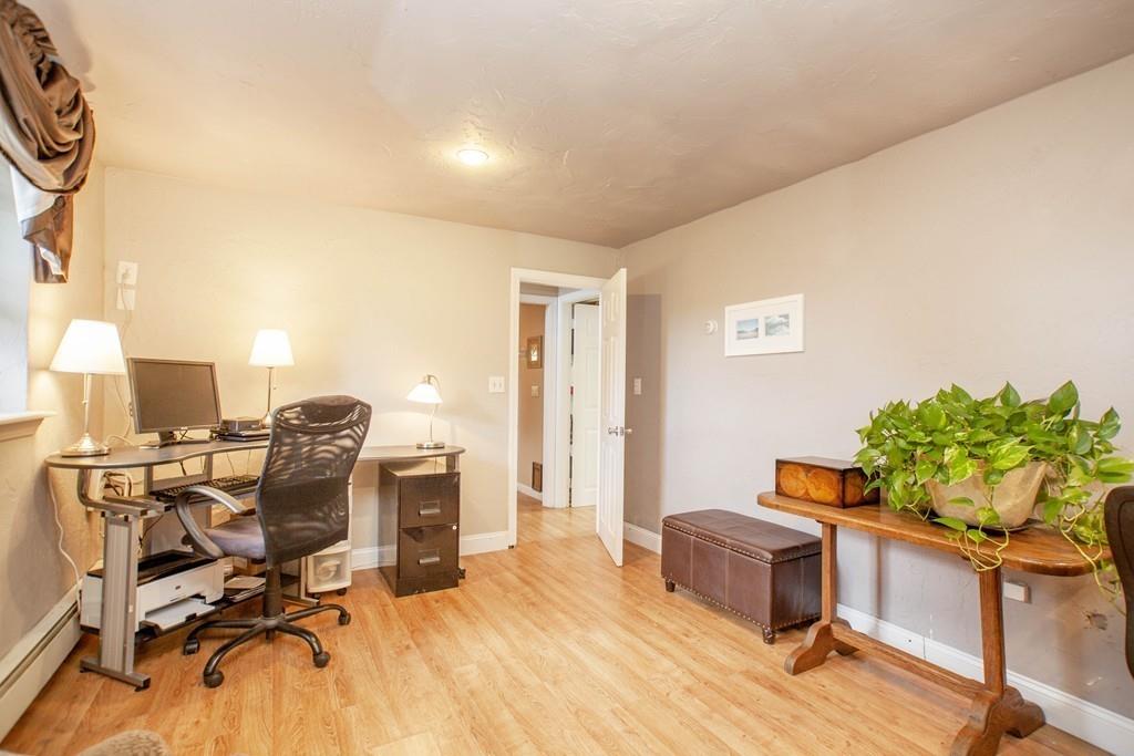 44 Dolan Road Millbury, MA 01527 - Photo 31 of 40 a workspace with furniture and a potted plant