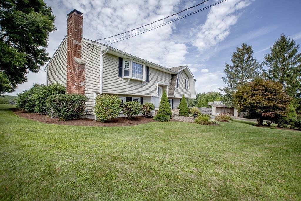 44 Dolan Road Millbury, MA 01527 - Photo 38 of 40 a front view of a house with garden