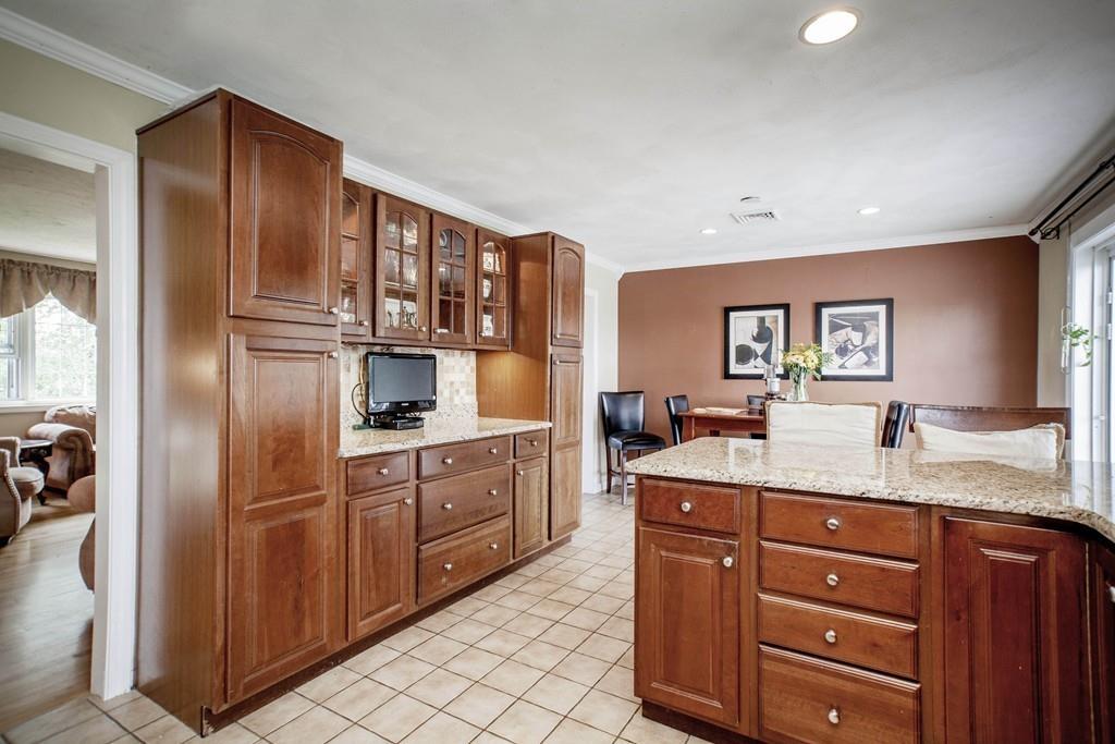 44 Dolan Road Millbury, MA 01527 - Photo 9 of 40 a kitchen with granite countertop stainless steel appliances a sink and cabinets