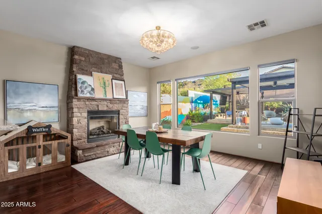 a kitchen with center island table and chairs in it