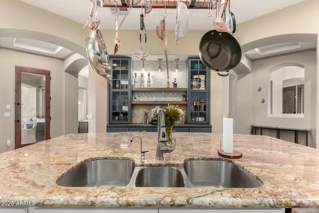 a bedroom with a bed and a computer on a desk