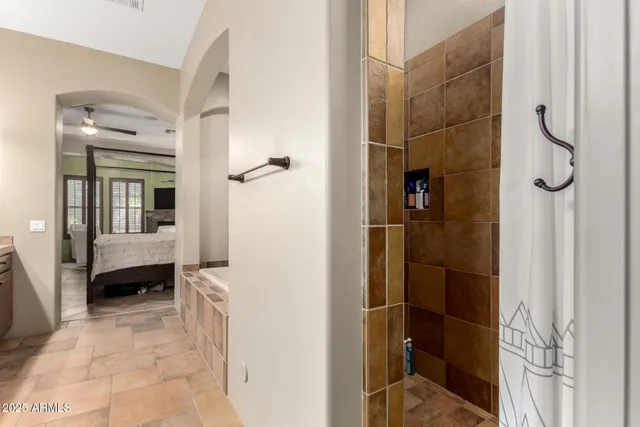 a bedroom with a bed and a lamp