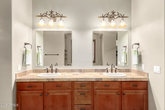 a view of a kitchen with sink and cabinets