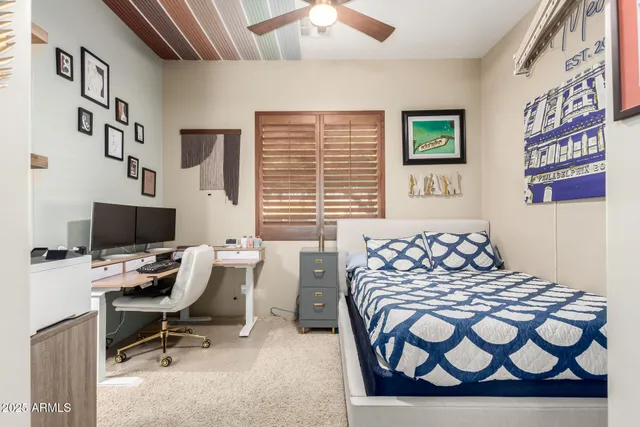 a view of a patio with table and chairs potted plants