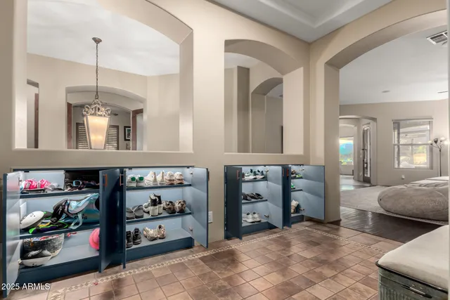 a dining room with furniture and wooden floor