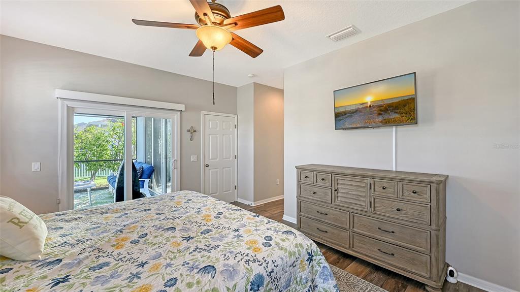 12274 23rd Street East Parrish, FL 34219 - Photo 18 of 64 a bedroom with a bed and a flat screen tv