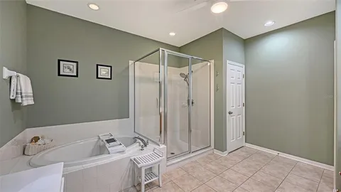 a bathroom with a bathtub a sink and a shower