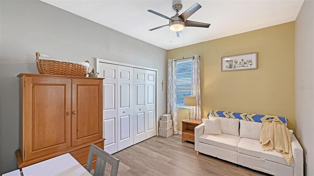 12274 23rd Street East Parrish, FL 34219 - Photo 25 of 64 a living room with furniture and a ceiling fan