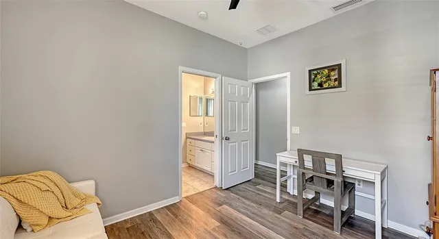 a white toilet sitting next to a shower curtain