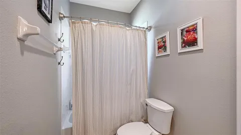 a view of a patio with table and chairs potted plants with wooden floor