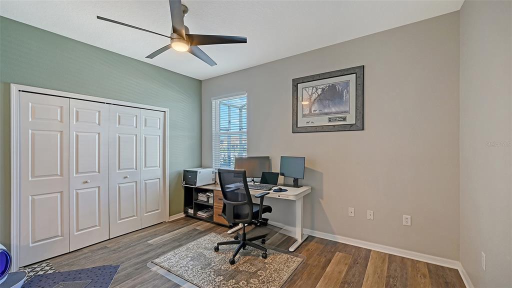 12274 23rd Street East Parrish, FL 34219 - Photo 29 of 64 a view of a workspace with furniture and a window