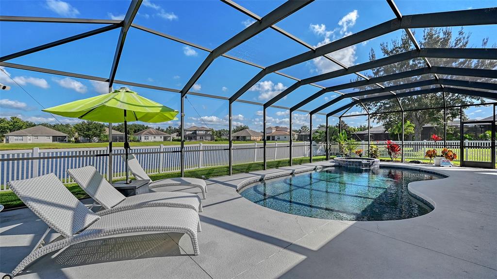 12274 23rd Street East Parrish, FL 34219 - Photo 34 of 64 a view of a swimming pool with a patio