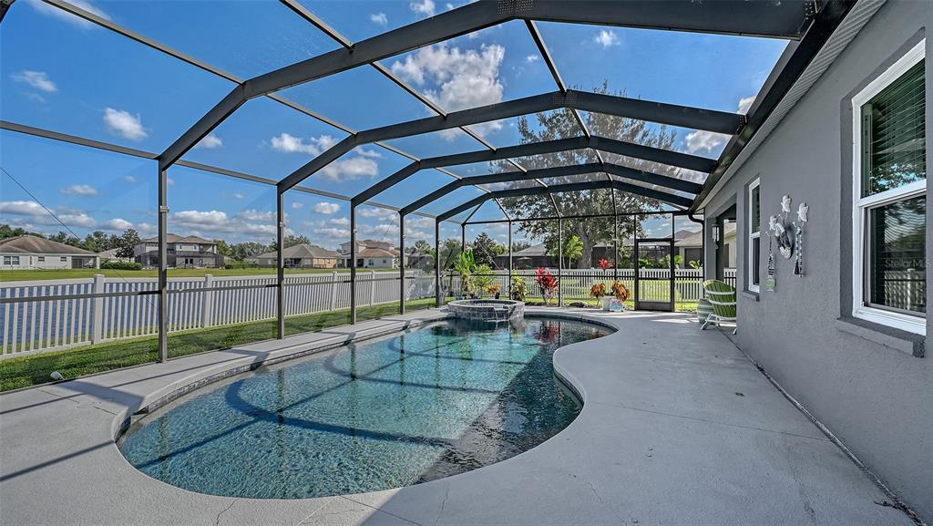 12274 23rd Street East Parrish, FL 34219 - Photo 35 of 64 a view of a swimming pool with a porch