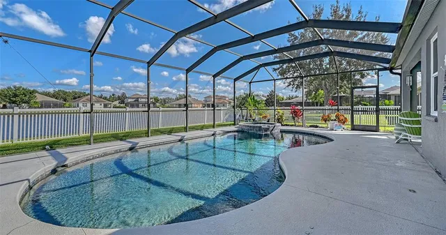 a view of a swimming pool with a patio