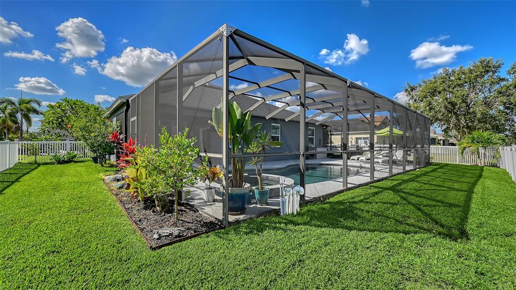 12274 23rd Street East Parrish, FL 34219 - Photo 40 of 64 a view of a house with a yard and plants