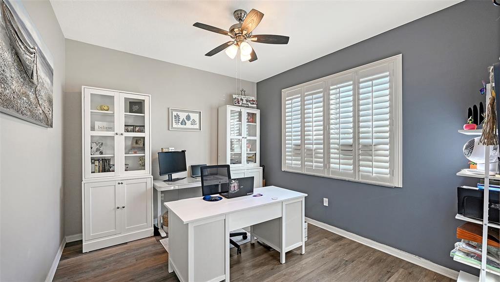 12274 23rd Street East Parrish, FL 34219 - Photo 4 of 64 a view of a workspace with furniture and a window