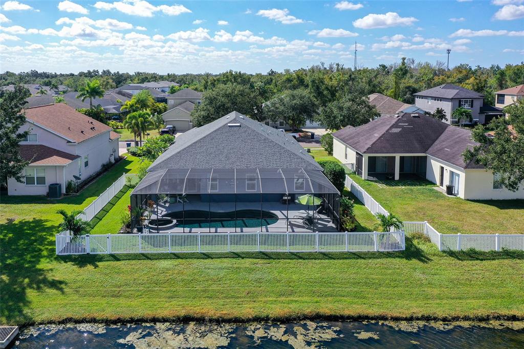 12274 23rd Street East Parrish, FL 34219 - Photo 42 of 64 a aerial view of a house with a garden and swimming pool